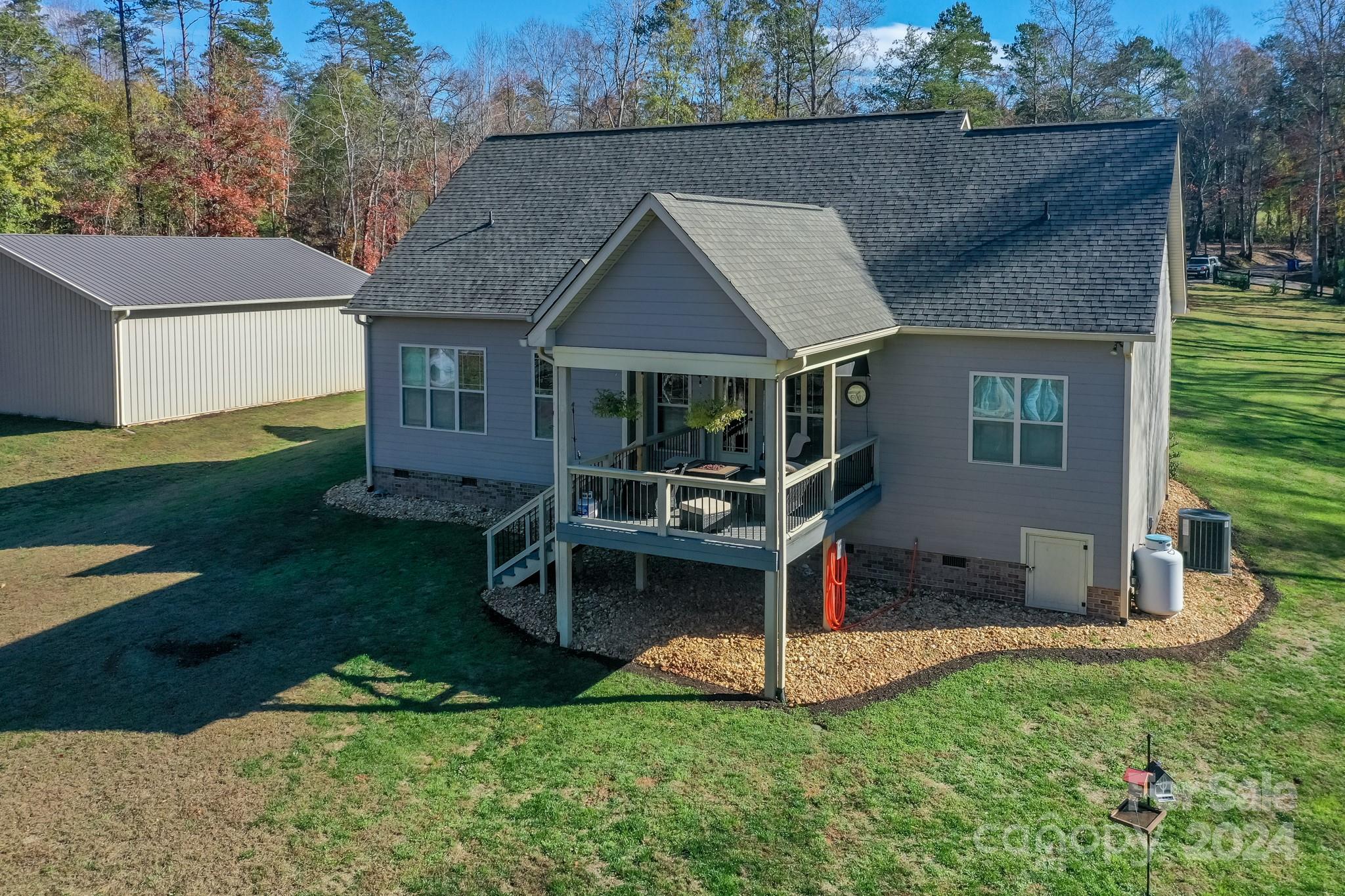 174 Spring Street Spindale, NC 28160 - Photo 21 of 30 a view of a house with a yard and deck