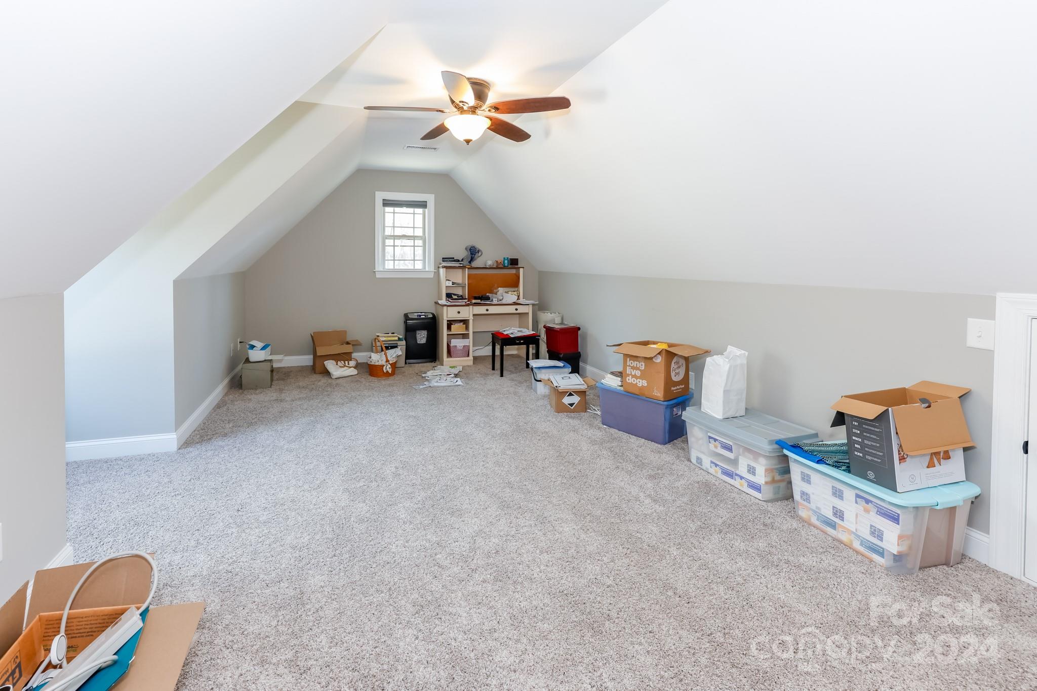 174 Spring Street Spindale, NC 28160 - Photo 22 of 30 a living room with furniture and a chandelier