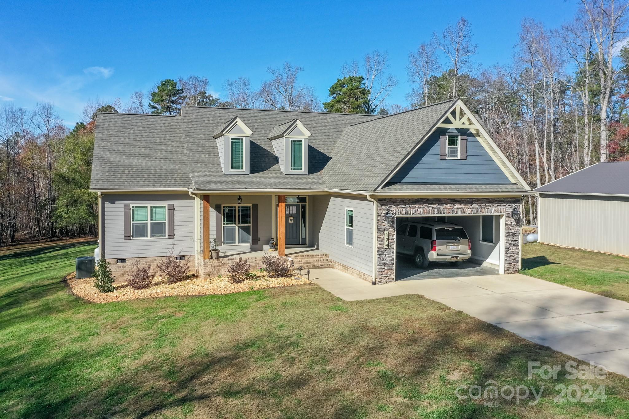 174 Spring Street Spindale, NC 28160 - Photo 29 of 30 a front view of a house with garden