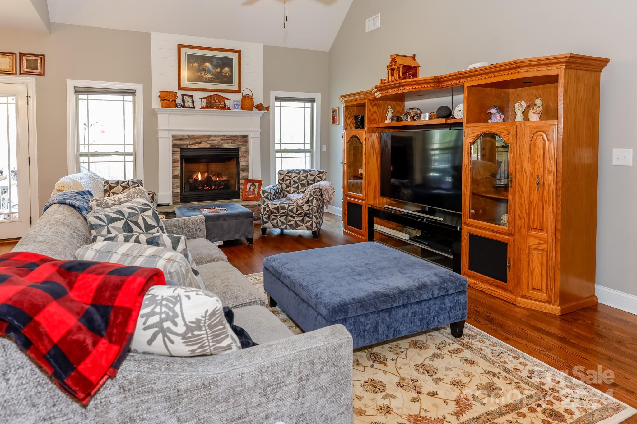 174 Spring Street Spindale, NC 28160 - Photo 4 of 30 a living room with furniture fireplace and flat screen tv