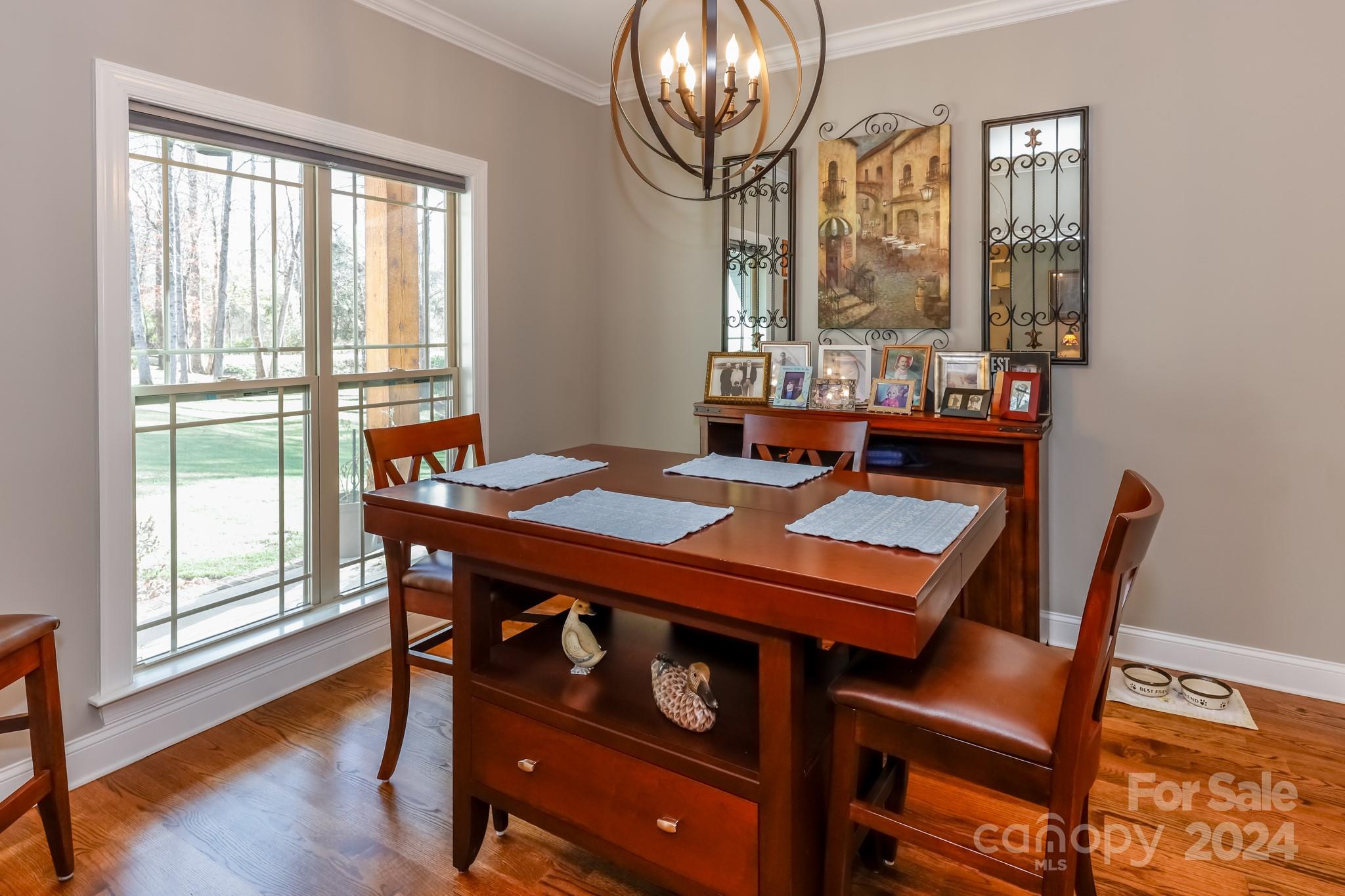 174 Spring Street Spindale, NC 28160 - Photo 10 of 30 a view of a dining room with furniture wooden floor and a chandelier