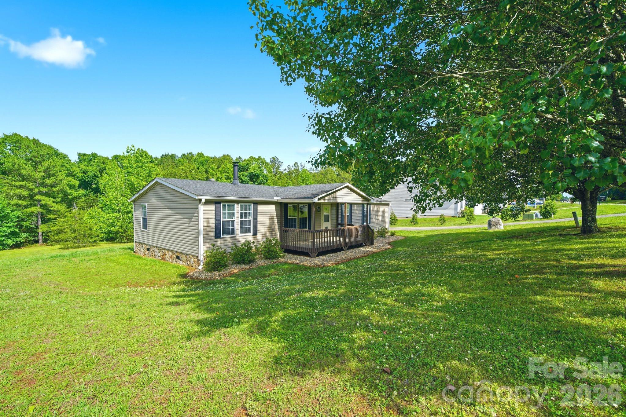 2368 Beth Haven Church Road Denver, NC 28037 - Photo 2 of 42 a view of a house with a big yard potted plants and large tree