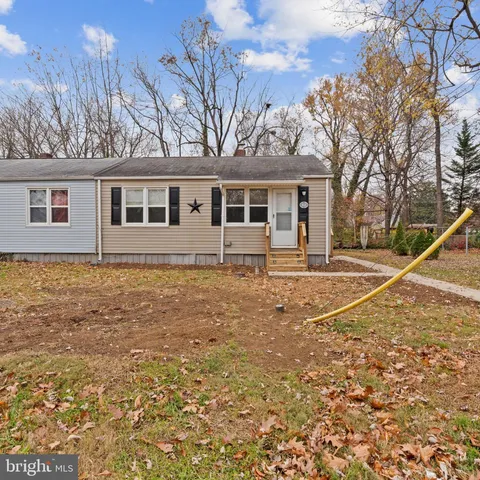 a front view of a house with yard