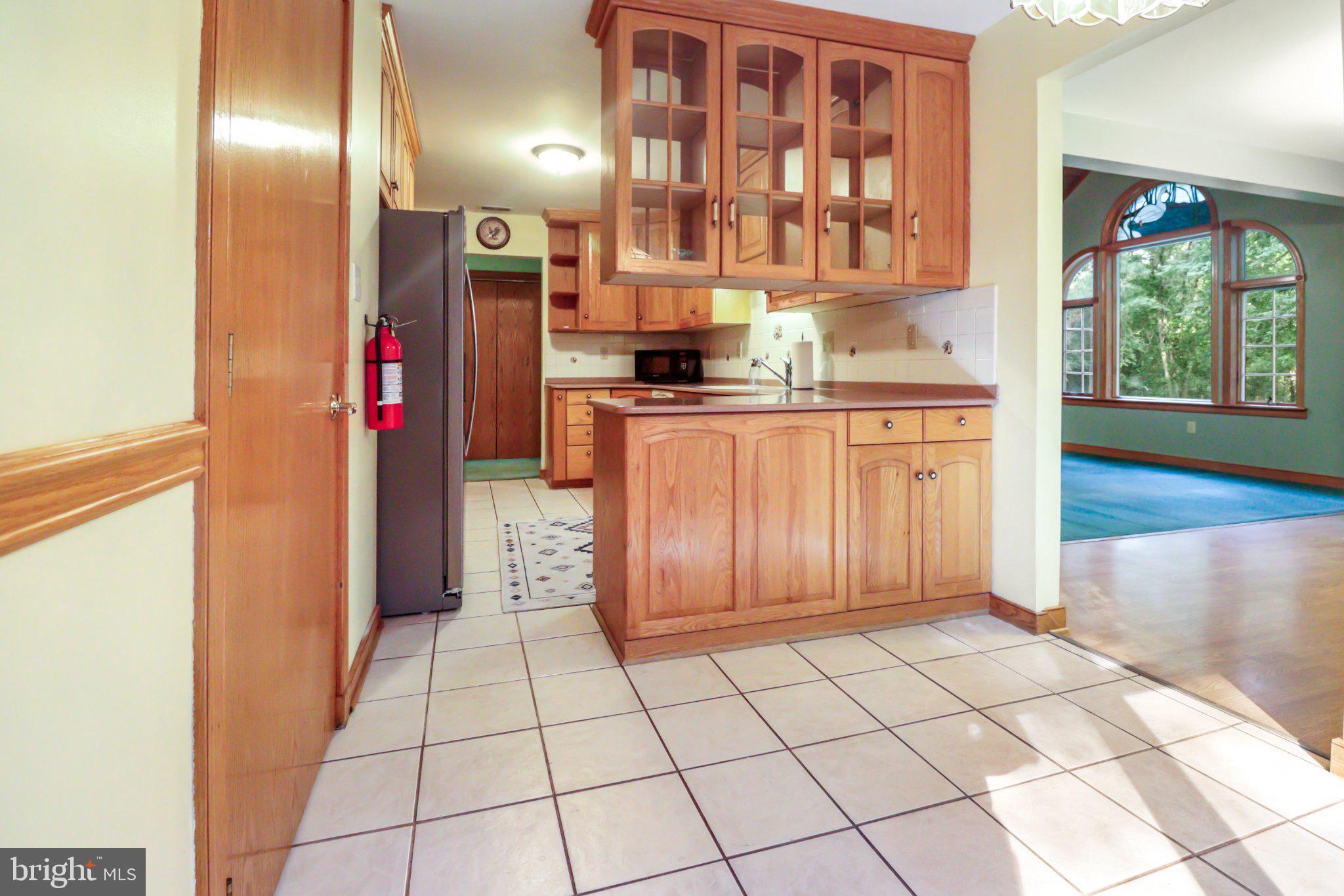 74 Cedar Road Pittsgrove, NJ 08318 - Photo 17 of 23 Inviting kitchen with warm wood accents.