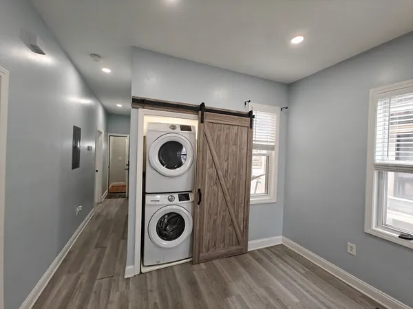a view of a storage and utility room with washer and dryer