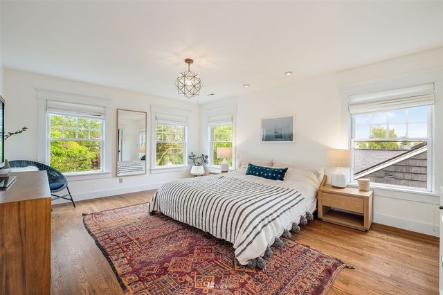 a bedroom with a large bed and a window