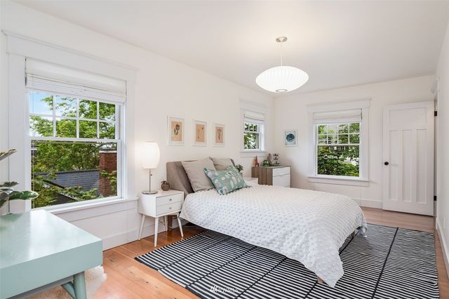 a bedroom with a large bed and a window