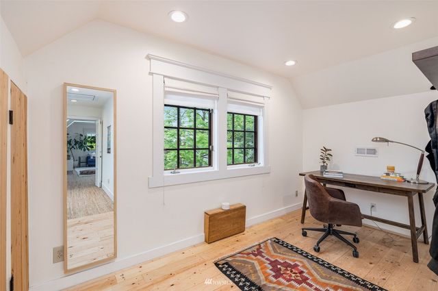 a workspace with furniture and a window