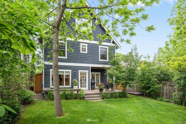 a front view of a house with a yard and porch