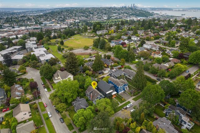 an aerial view of residential houses with outdoor space
