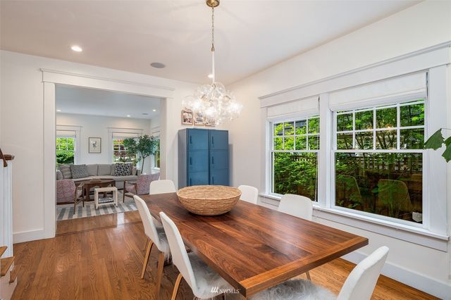 a outdoor dining space with furniture and wooden floor