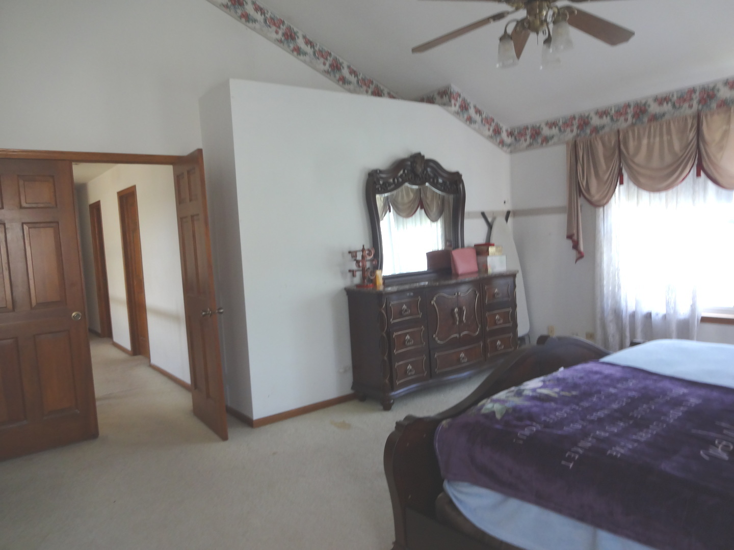 1340 Vernon Lane Bartlett, IL 60103 - Photo 13 of 24 a bedroom with a bed dresser and a window