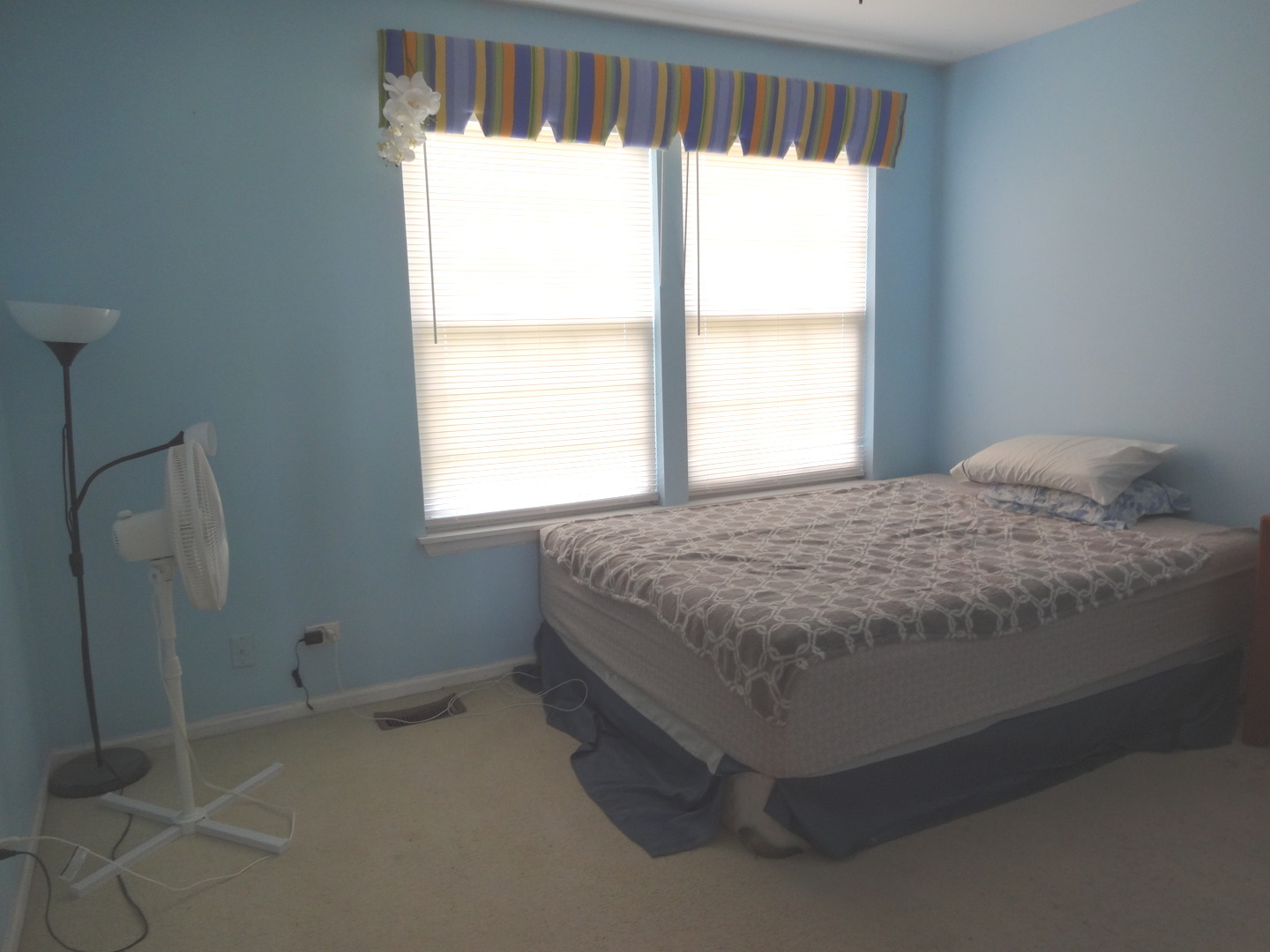 1340 Vernon Lane Bartlett, IL 60103 - Photo 16 of 24 a bed sitting in a bedroom next to a window