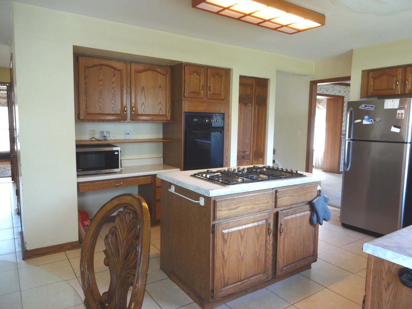 1340 Vernon Lane Bartlett, IL 60103 - Photo 8 of 24 a kitchen with a stove top oven and refrigerator