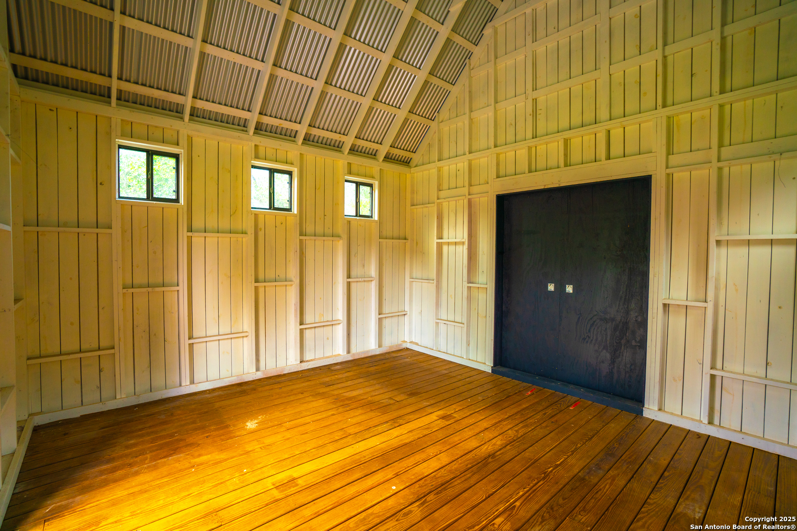 101 Bella Springs Road Boerne, TX 78006 - Photo 44 of 50 a view of empty room with wooden floor and fan