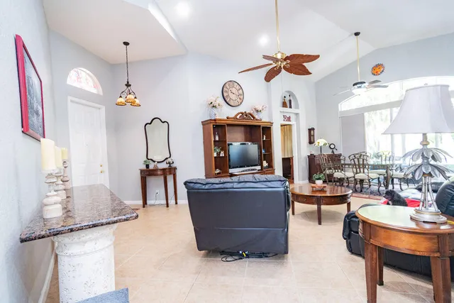 an aerial view of a house with a yard and garden