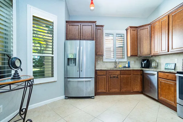an aerial view of a house with a yard and garden