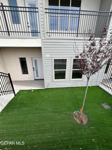 a view of a balcony with furniture