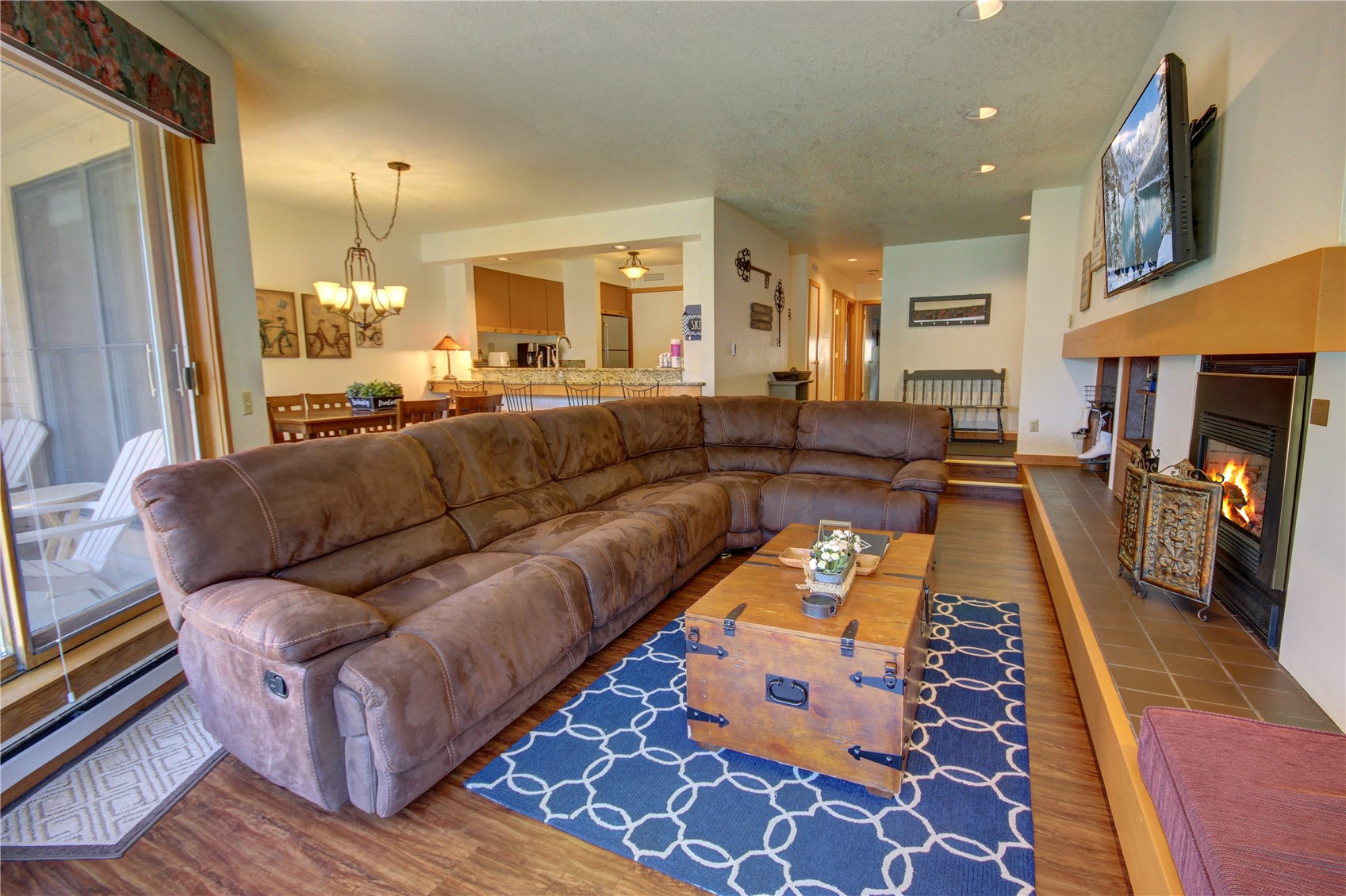 180 Tennis Club Road, Unit 1648 Keystone, CO 80435 - Photo 11 of 18 Living room with hardwood / wood-style floors and ceiling fan with notable chandelier