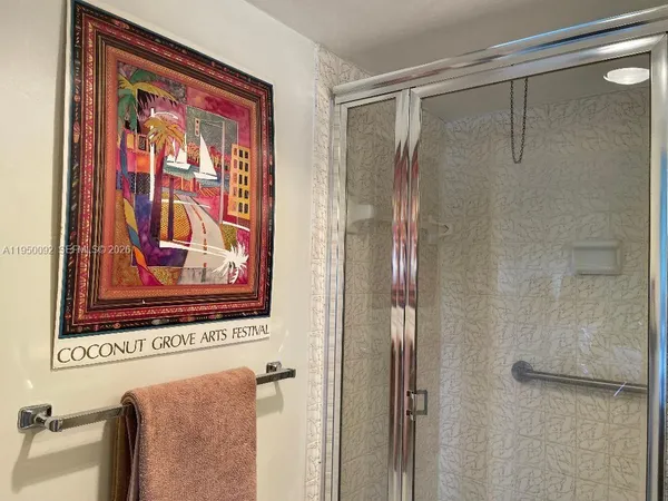 a bathroom with a shower and a sink