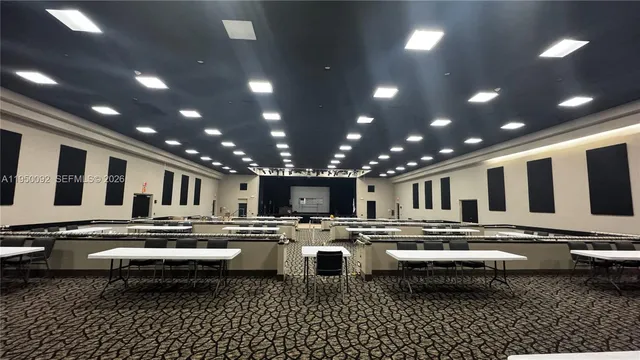 a kitchen with stainless steel appliances a stove a sink and a refrigerator