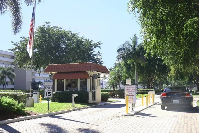 a view of a house with a yard and tree s
