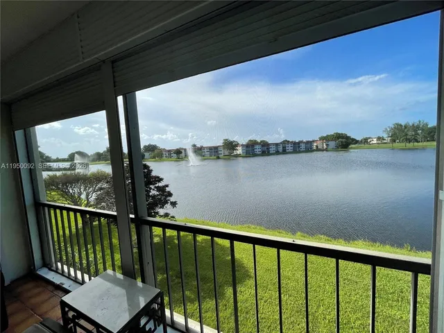 a view of a balcony with lake view and mountain view