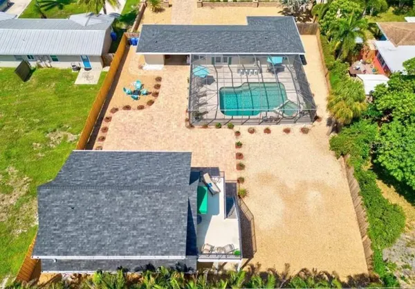 a aerial view of a house with a yard