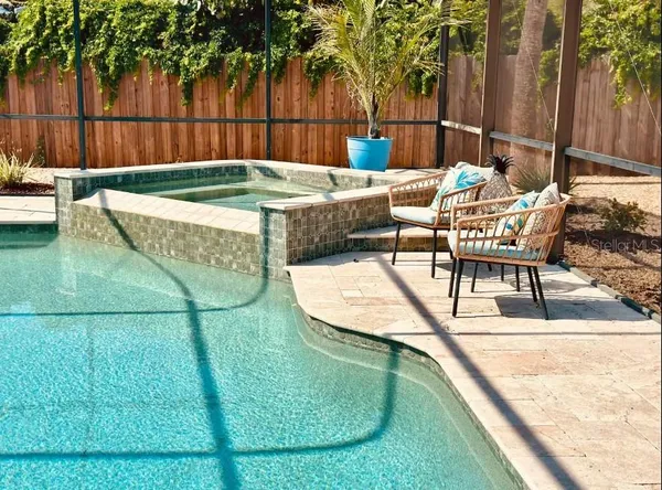 a view of a chairs and dinning table in patio