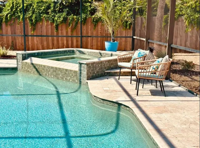 a view of a chairs and dinning table in patio