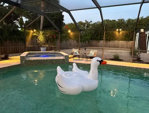 a view of a swimming pool with a patio
