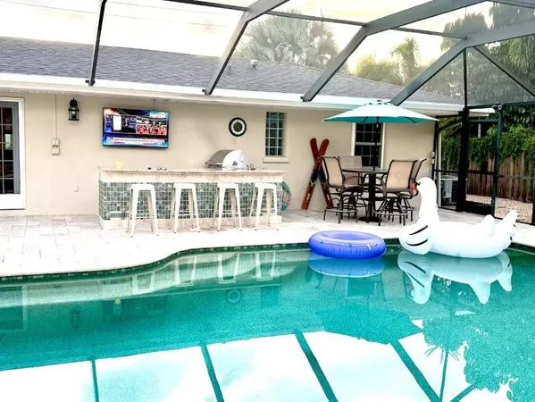 a view of a patio with chairs and a table