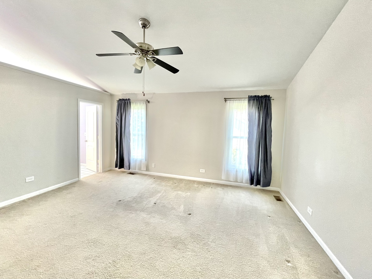 2250 Lakeside Drive Aurora, IL 60504 - Photo 16 of 26 a view of a livingroom with a ceiling fan and window
