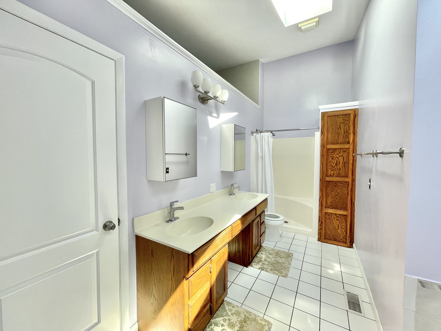 2250 Lakeside Drive Aurora, IL 60504 - Photo 18 of 26 a bathroom with a tub sink and a mirror