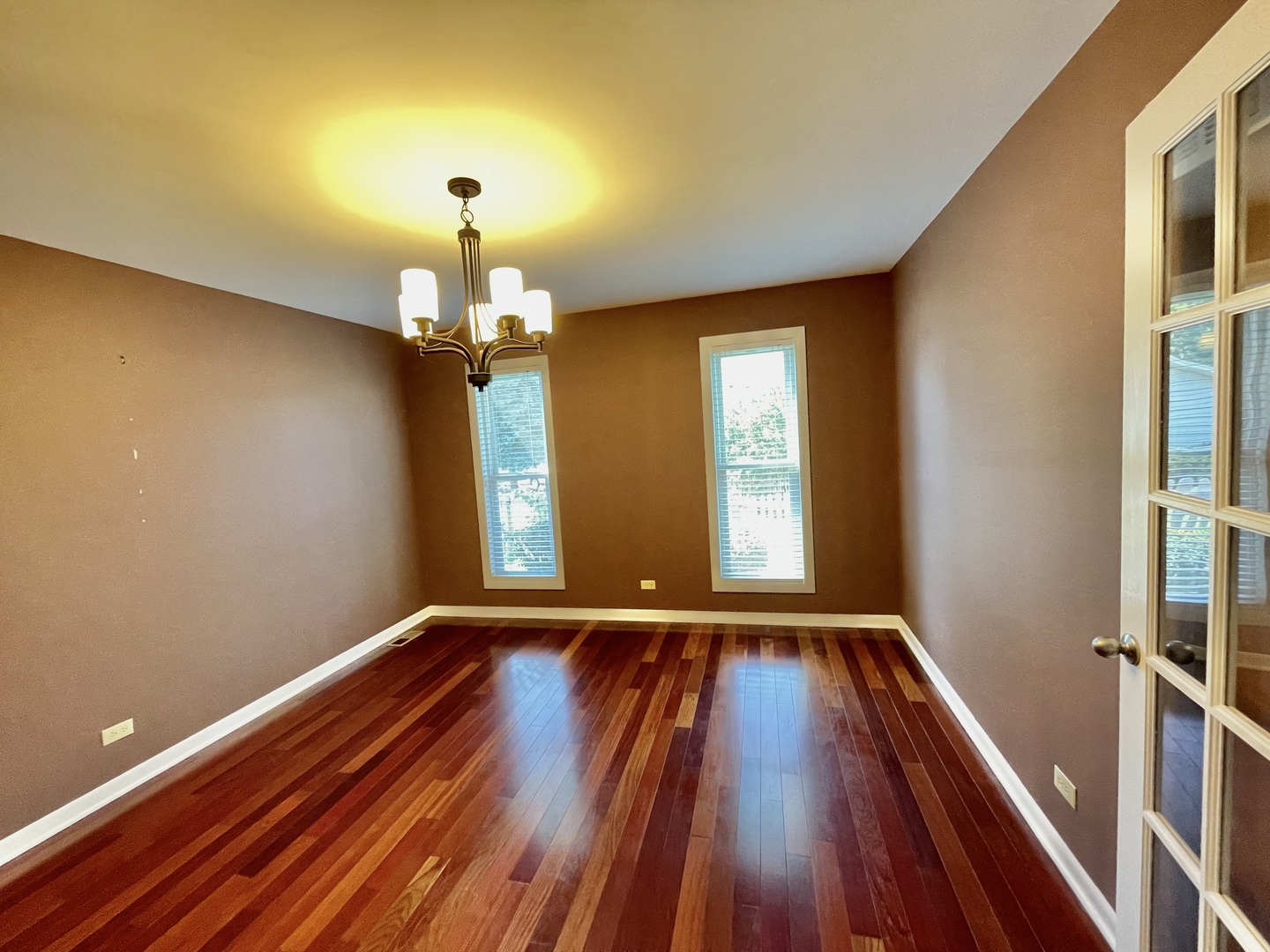 2250 Lakeside Drive Aurora, IL 60504 - Photo 6 of 26 a view of empty room with wooden floor and fan