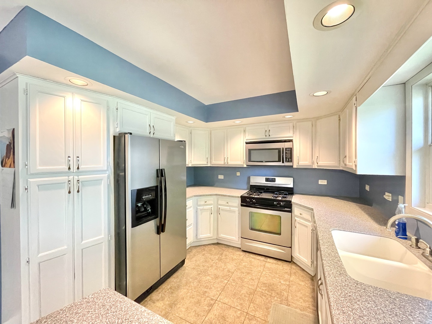2250 Lakeside Drive Aurora, IL 60504 - Photo 7 of 26 a kitchen with a refrigerator sink and stove