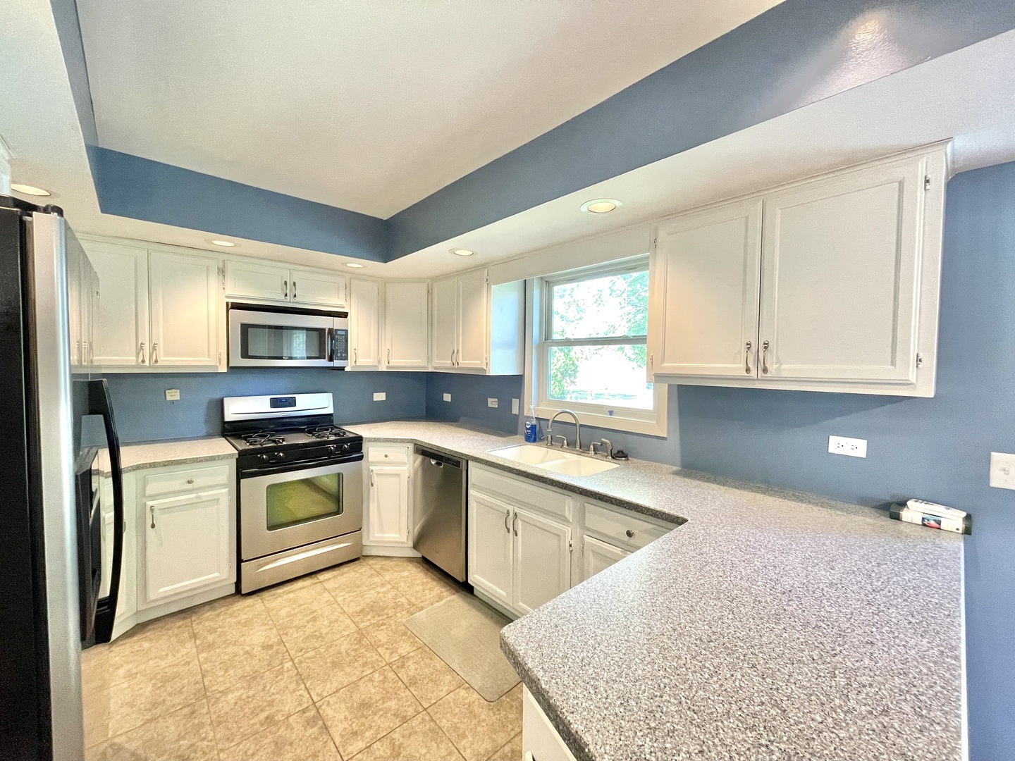 2250 Lakeside Drive Aurora, IL 60504 - Photo 8 of 26 a kitchen with a sink stove top oven and refrigerator