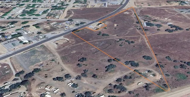 a view of a road with a snow in the background