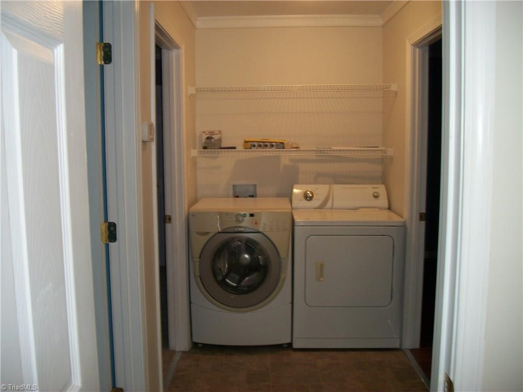 785 Light Road Thomasville, NC 27360 - Photo 12 of 21 HALL/LAUNDRY AREA/NEW LAMINATE FLOOR/FRESH PAINT