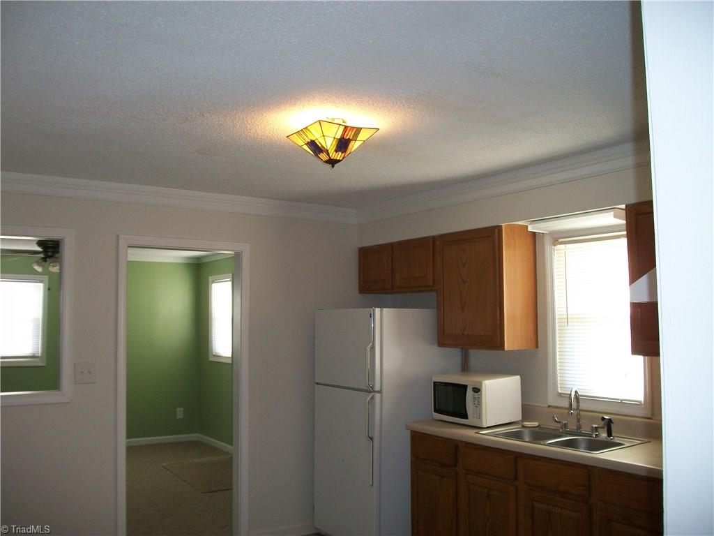 785 Light Road Thomasville, NC 27360 - Photo 9 of 21 KITCHEN/LOTS OF CABINETS/NATURAL LIGHT/SINK WINDOW