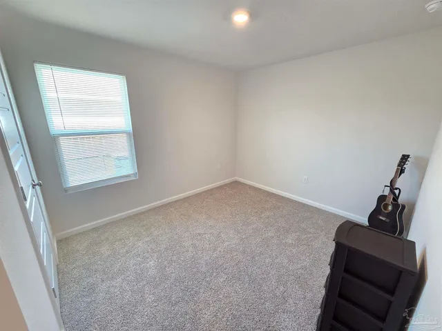 a view of room with window and workspace