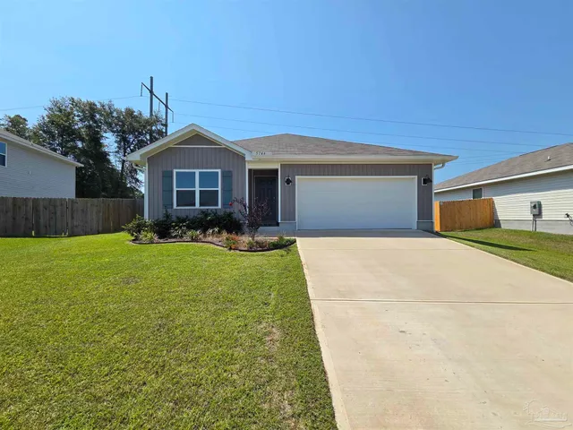 a front view of a house with a yard and porch