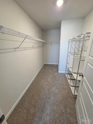 a view of a room with racks on the wall