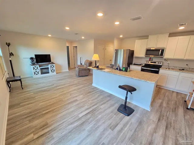 a room with furniture and a wooden floor