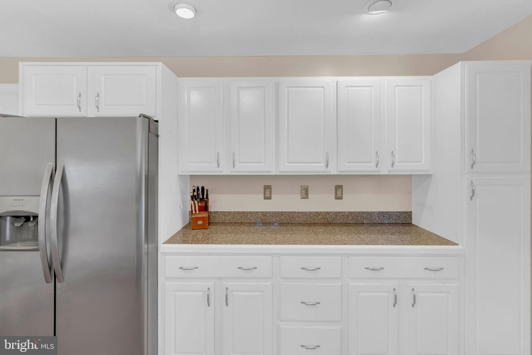 218 Keeley Avenue Doylestown, PA 18901 - Photo 12 of 42 a kitchen with stainless steel appliances white cabinets and a refrigerator
