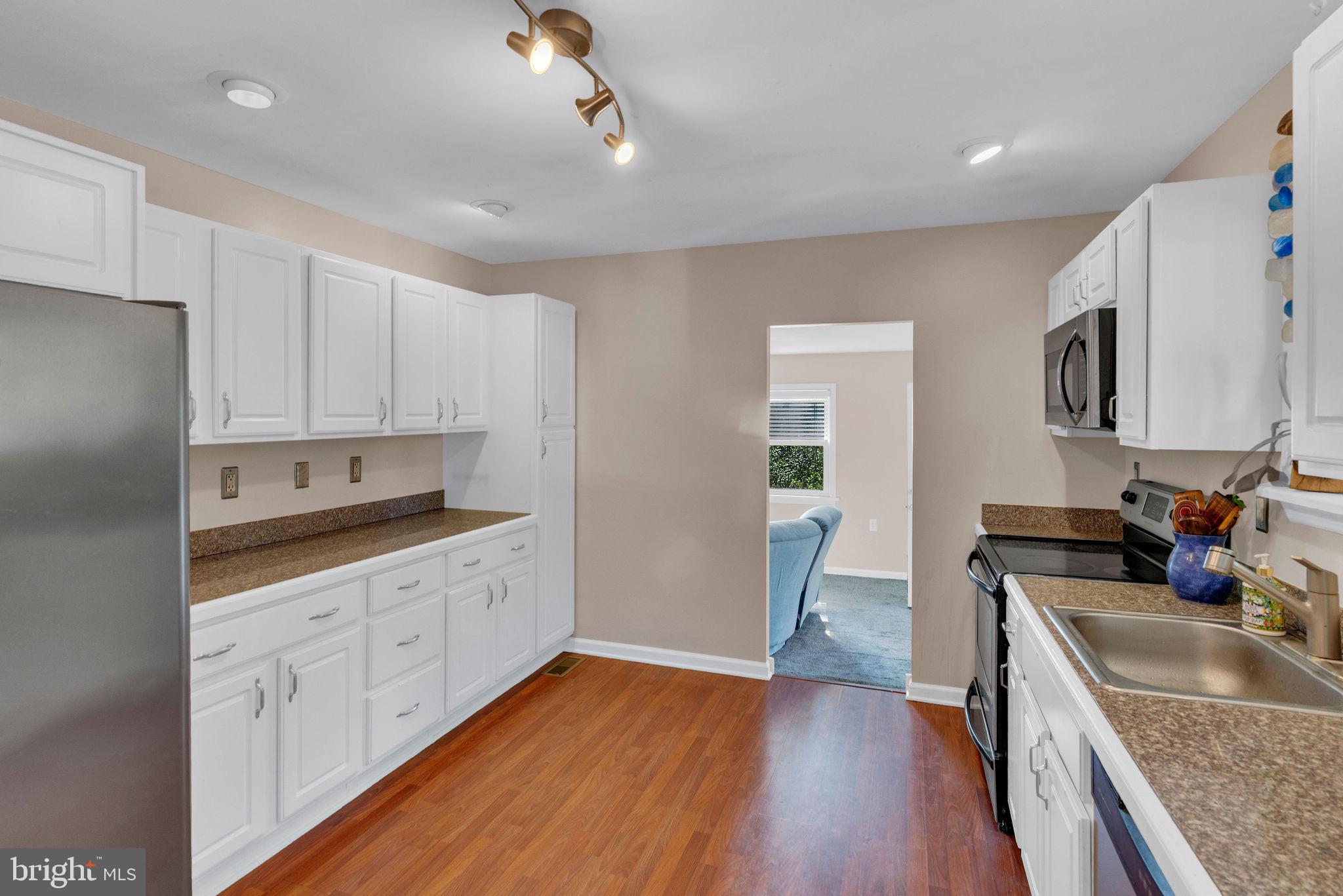 218 Keeley Avenue Doylestown, PA 18901 - Photo 13 of 42 a kitchen with granite countertop a sink stove and cabinets