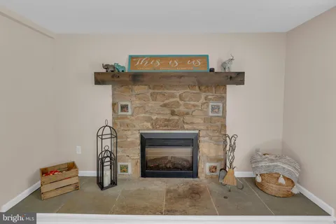 a fireplace with a vase on top of it