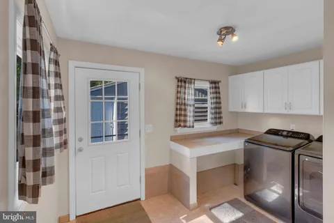 a kitchen that has a sink and a stove in it