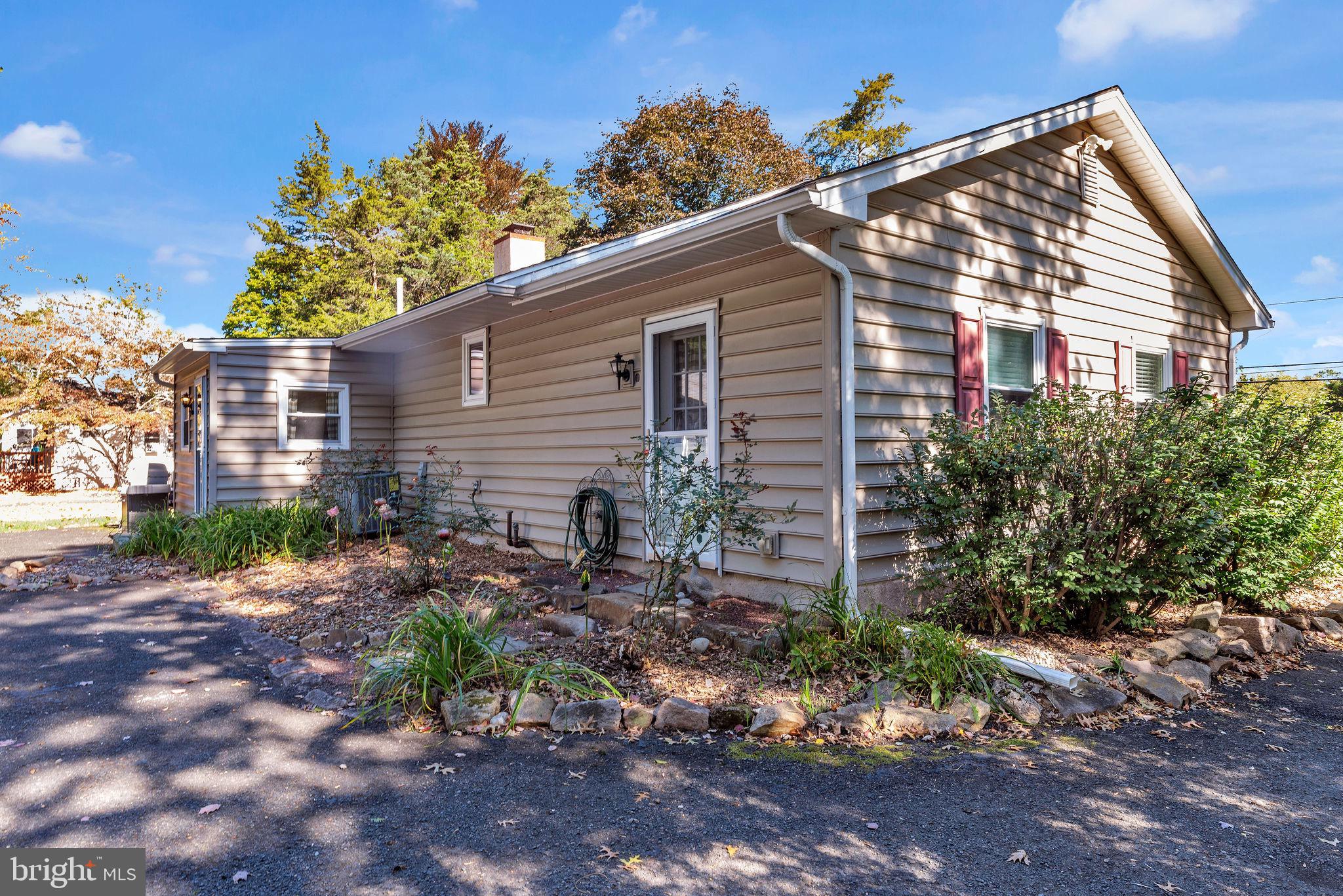 218 Keeley Avenue Doylestown, PA 18901 - Photo 30 of 42 a view of a house with a yard and a garden