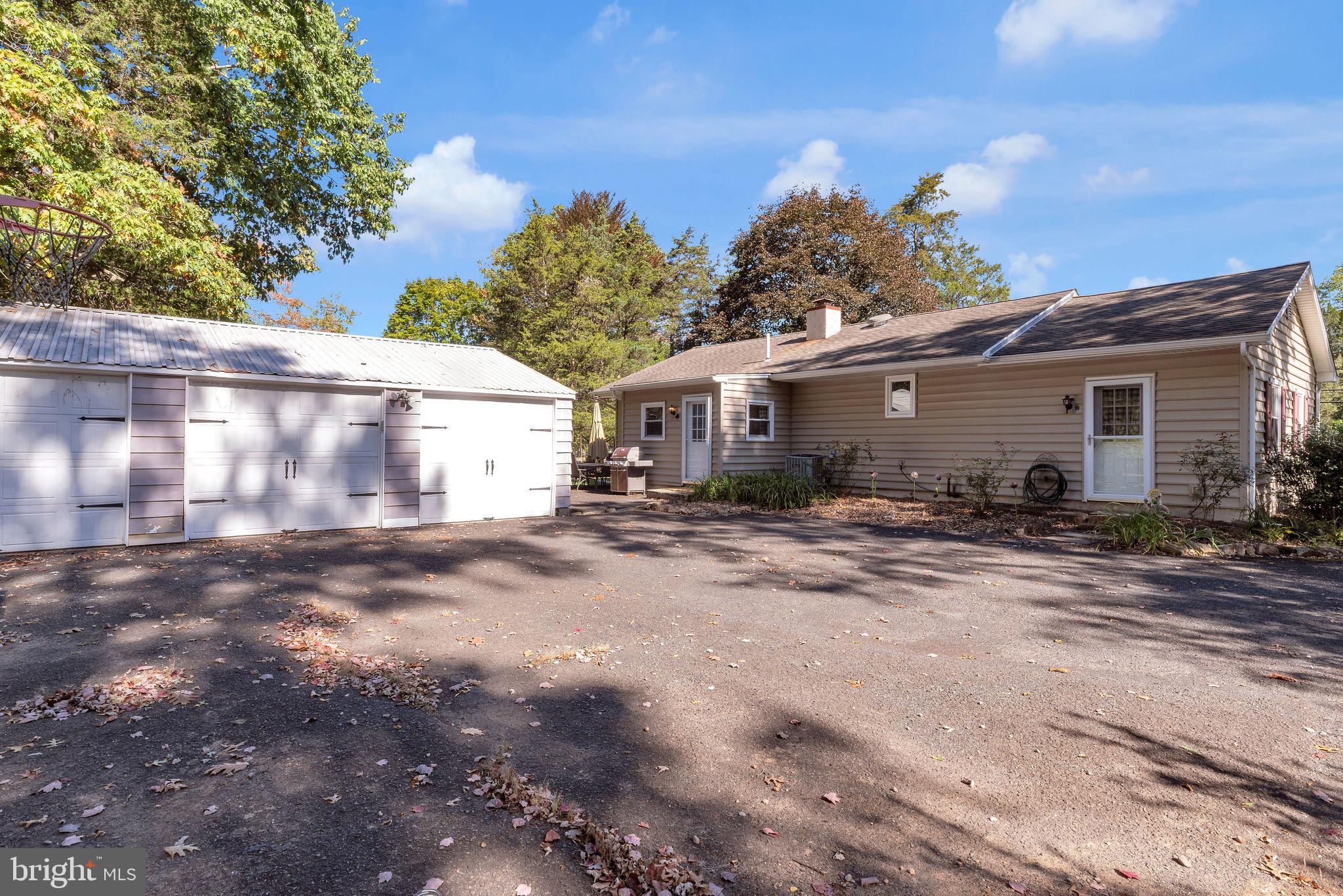 218 Keeley Avenue Doylestown, PA 18901 - Photo 3 of 42 a view of a white house with a yard and large trees
